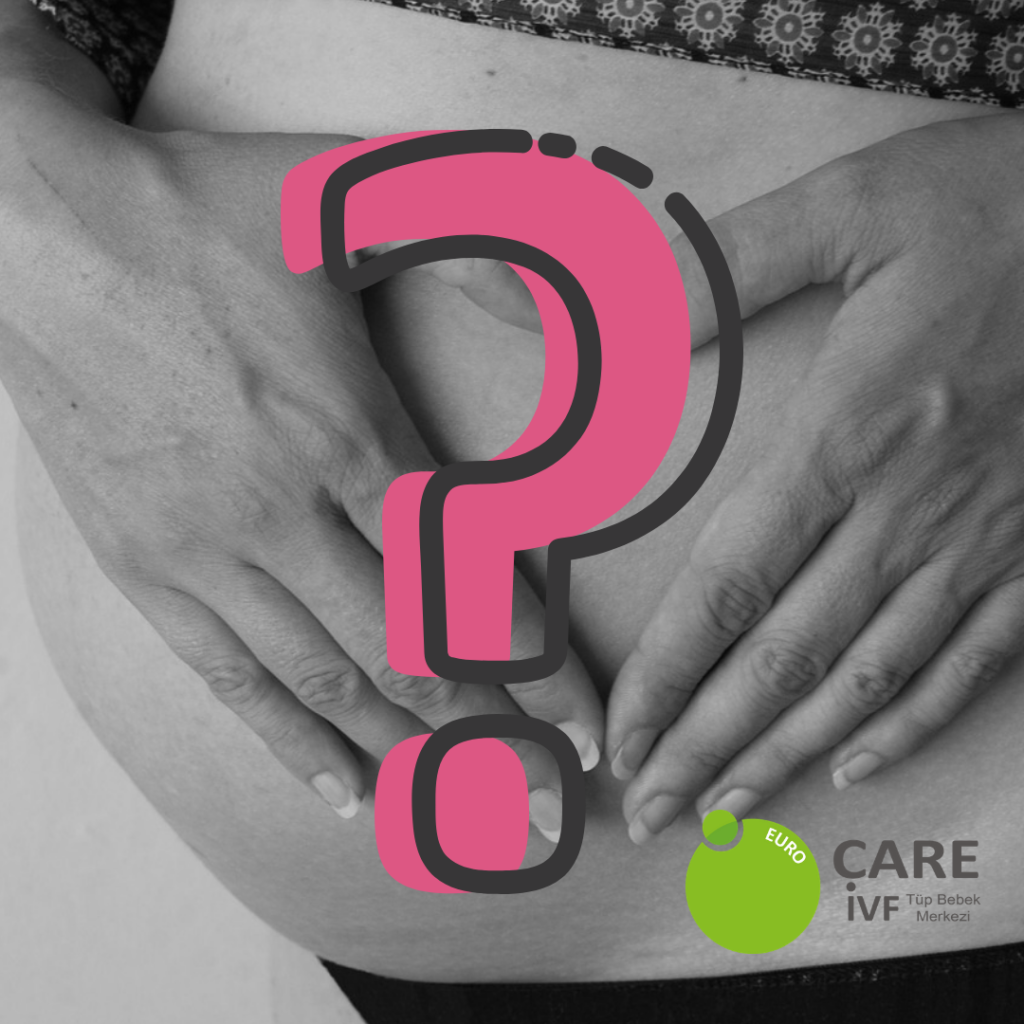 Pregnant woman holding belly with image of question mark