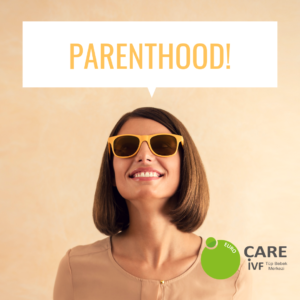 Woman in yellow sunglasses with big smile thinking about parenthood