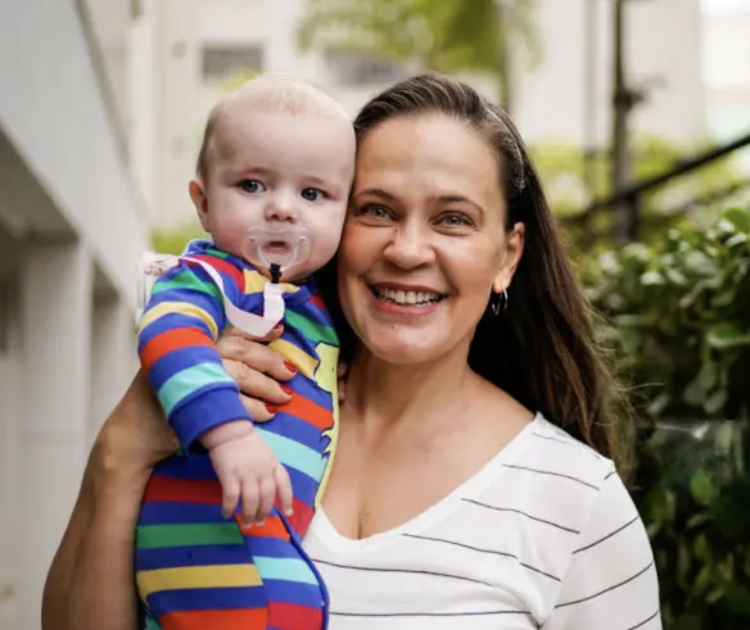 woman with baby mobile