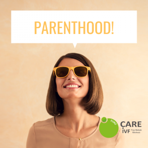 Woman in yellow sunglasses with big smile thinking about parenthood Woman in yellow sunglasses with big smile thinking about parenthood